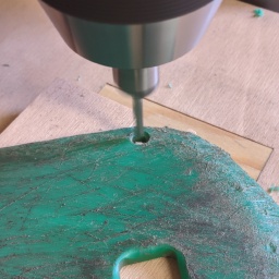 This is a countersinking drill bit in the drill chuck, a common one used for wood. I'm using a depth stop on the drill press to keep the countersink somewhat consistent. I also have some pieces of plywood under the float plate, as it doesn't sit flat bottom-up.