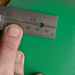 The corners of the original hole seem to have 3mm radius (verified by putting 6mm drill bit into the corner), here I'm marking centers for the corner holes.