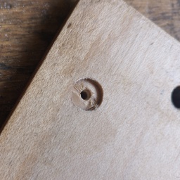 Inset hole drilled. The bottom is a bit angled, for best fit clean it up with a small chisel or a knife.