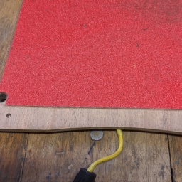Front footpad with new grip tape and sanded for new finish application.
