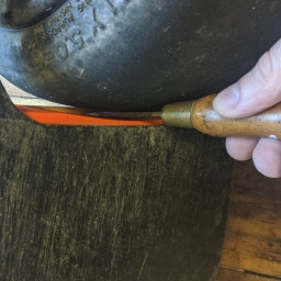 Marking the bottom of the footpad with a sharp tool along the curve of the connector cover.